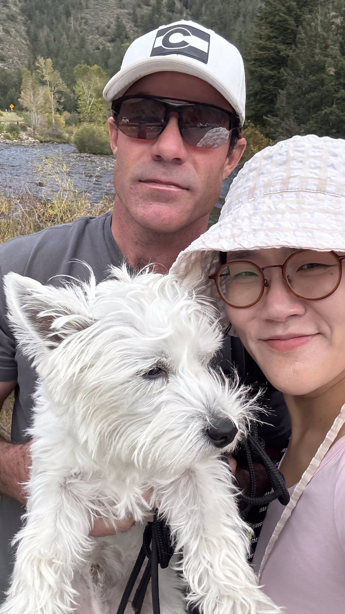 James, Anna, and Ozzy by a river in Colorado